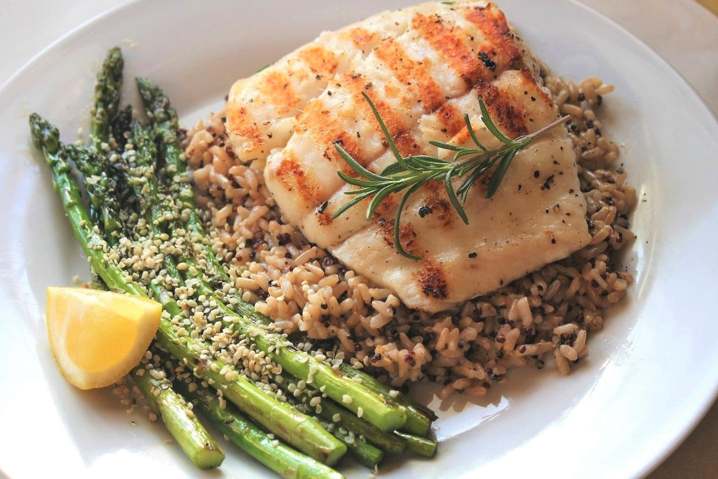 OLIVE WOOD SMOKED GRILLED HALIBUT WITH MUSHROOM WILD RICE